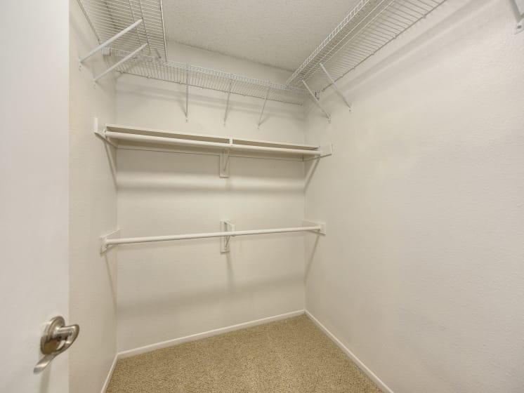 Extended Closet with White Walls, Shelves and Shelves